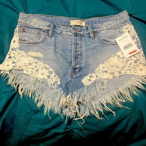 NWT free people denim shorts with fringe and lace sz 28